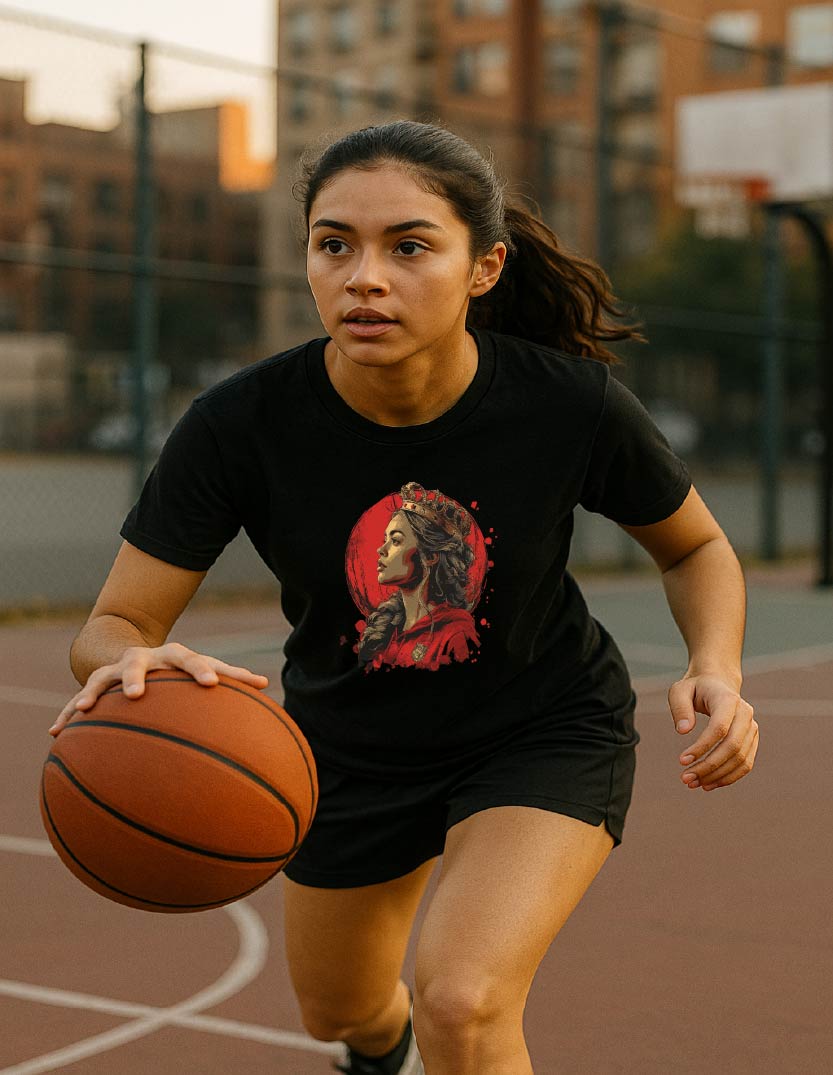 Woman holding a basketball on an outdoor court with a graphic t-shirt