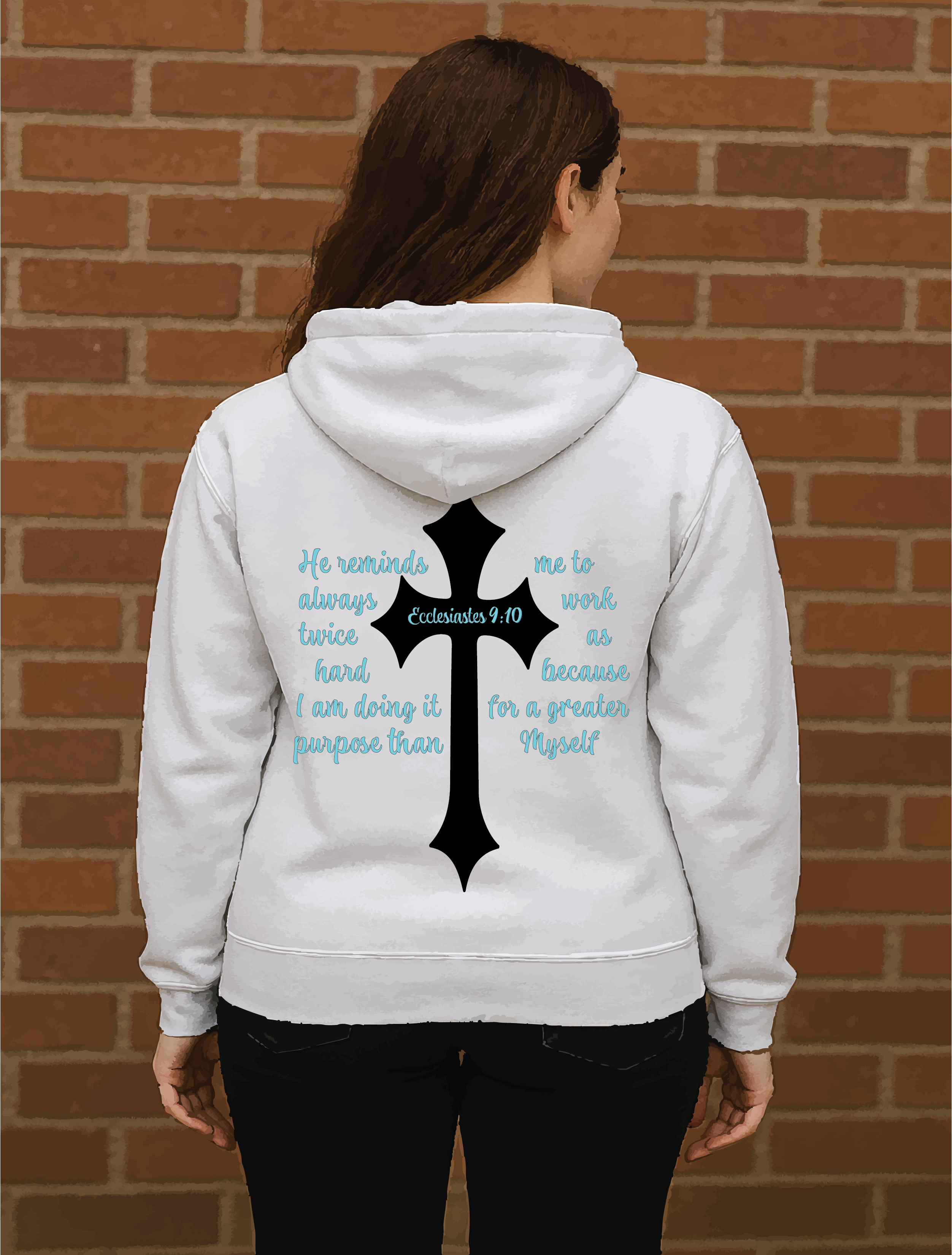 Person wearing a white hoodie with a cross and text design on the back, standing against a brick wall.