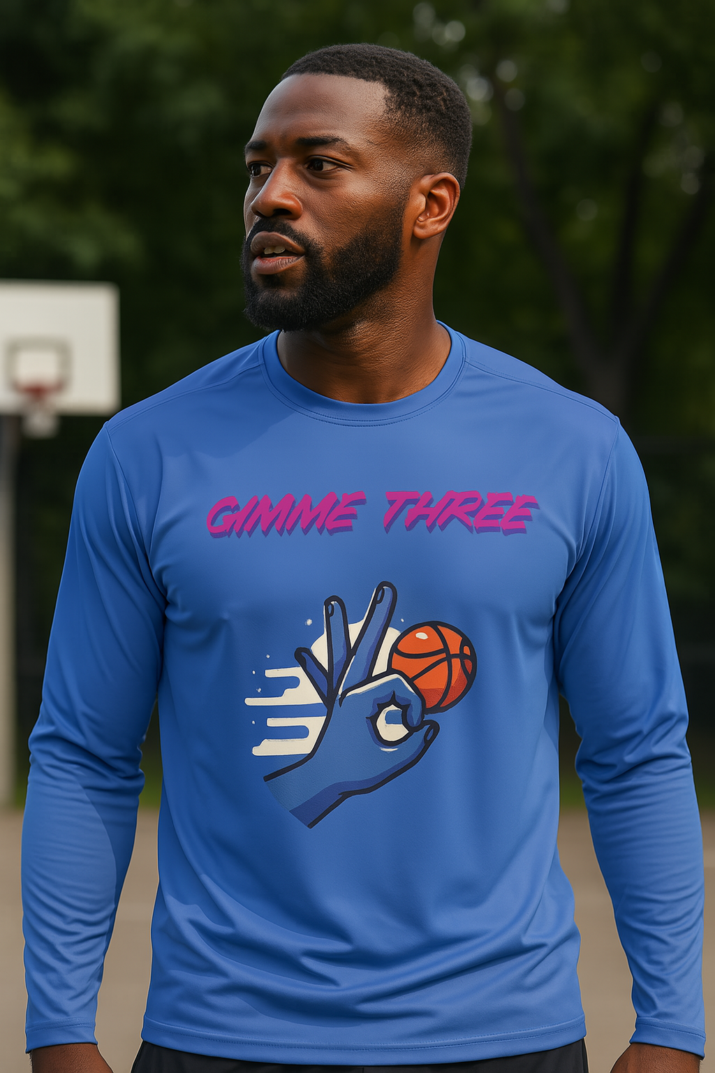Man wearing a blue long-sleeve shirt with a graphic design and text on a basketball court.